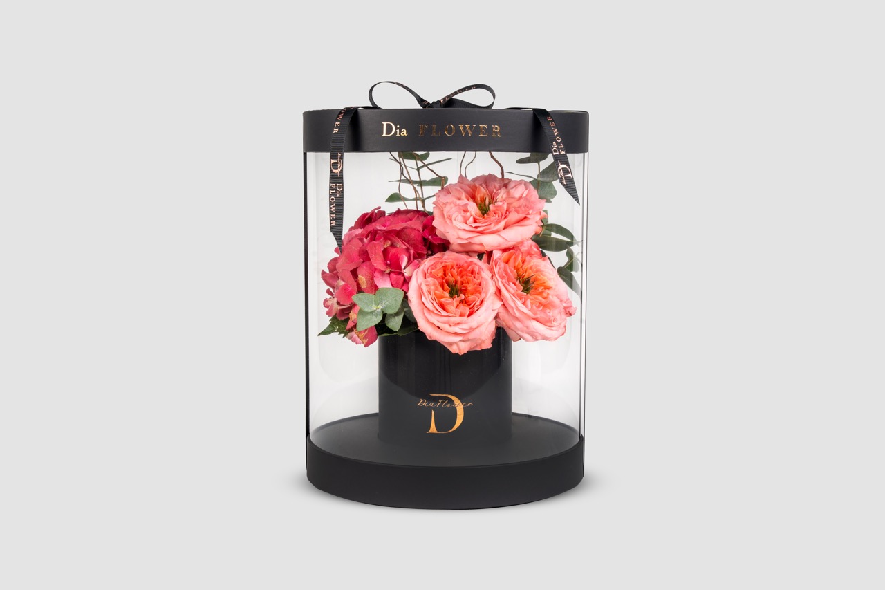 Premium flowers in clear acrylic display