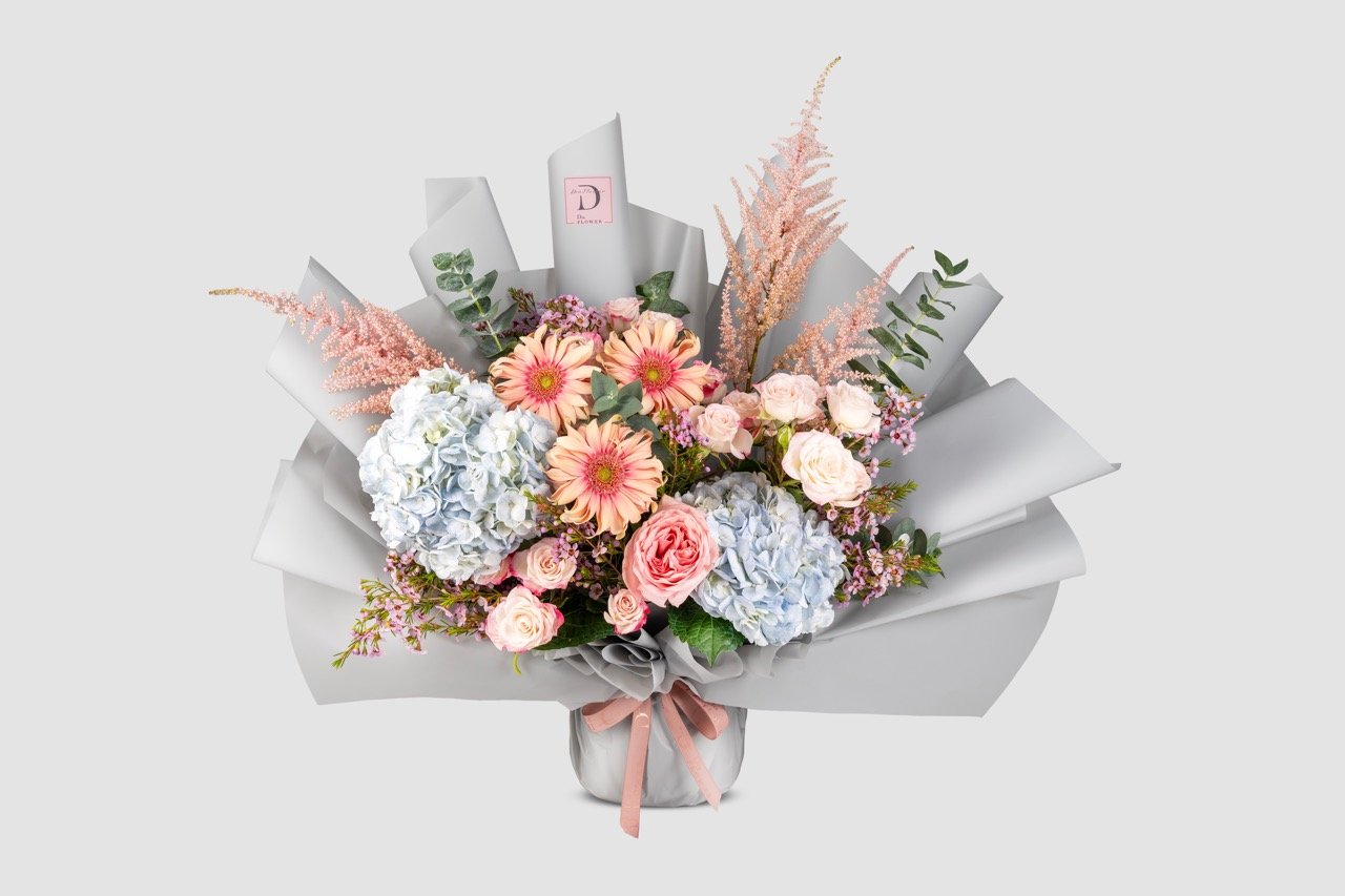 Medium Aura Bloom bouquet with grey wrapping	