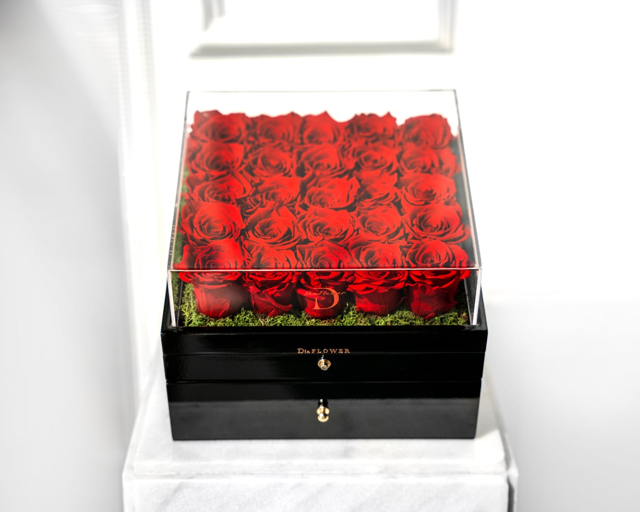 Roses in wooden boxes with chocolates